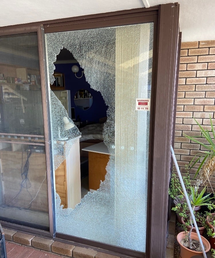 Shattered glass in a sliding door before repair