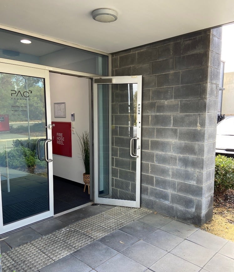 Commercial glass entry door and sidelight at a business